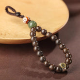 Schlüsselanhänger aus natürlichem Hetian-Jade und Brunei-Adlerholz mit Tierkreiszeichen und Schutzbuddha