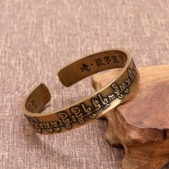 Bracelet de guérison tibétain en cuivre et laiton avec mantra Mahāpratisarā sanskrit