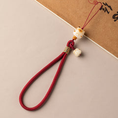 Bodhi Maneki Neko Charm: Handyband und Armband für Glück