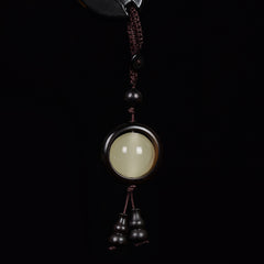 Eleganter Vintage-Schlüsselanhänger: Sandelholzanhänger mit Leuchtperle