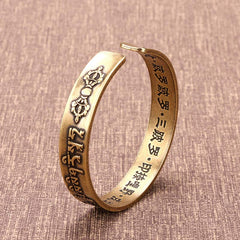 Bracelet de guérison tibétain en cuivre et laiton avec mantra Mahāpratisarā sanskrit