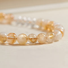 Gelber Quarz-Handyanhänger und stylisches Armband mit positiver Energie