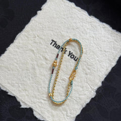 Pulsera de calabaza trenzada de doble capa | Cadena apilable con borlas, joyería artesanal