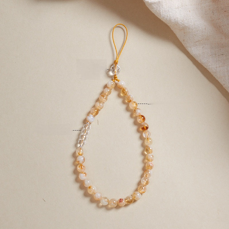 Gelber Quarz-Handyanhänger und stylisches Armband mit positiver Energie