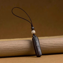 Glücksbringer aus schwarzem Ebenholz: Schlüsselanhänger &amp; Handy-Anhänger